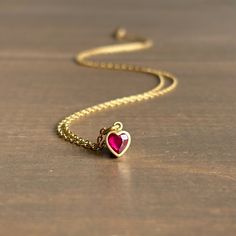 Get swept up in a rosy glow with this sweet, steadfast ruby heart pendant. 18k yellow gold Ruby, 0.42ct, 4mm x 5mm (3/16" x 3/16")Chain is 18" long Ruby Heart Pendant, Ruby Heart, Heart Pendant, Ruby, Fine Jewelry, Yellow Gold, Chain, Pendant, Gold