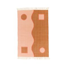 an orange and pink rug with circles on it