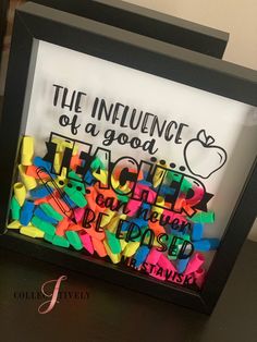 a framed sign with the words, the influence of a good teacher can always be found