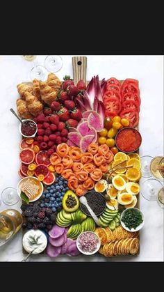 a large platter filled with lots of different types of fruits and veggies