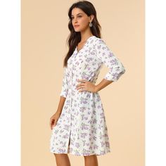 With its pretty floral print, the dress is an elegant and feminine option. With a classic fit and flare shape, the below-the-knee length dress is perfect for summer occasions. This pretty summer dress has a flattering fit-and-flare silhouette. Featuring an all-over floral print, the dress has inverted pleats detailing throughout, V-neckline, and short sleeves. Vintage-inspired and tailored to fit-and-flare silhouette, it features short sleeves, a button front, and a v-neckline for a pretty aesth 3/4 Sleeve Floral Midi Dress For Daywear, Floral Print Midi Dress With 3/4 Sleeves For Daywear, White Floral Print Midi Dress With 3/4 Sleeves, Feminine Midi Dress With 3/4 Sleeves, White Midi Dress With Floral Print And 3/4 Sleeves, Daywear Dresses With Floral Print And 3/4 Sleeves, Floral Print Knee-length Shirt Dress For Daywear, Feminine A-line Floral Dress For Daywear, Carmen Dress