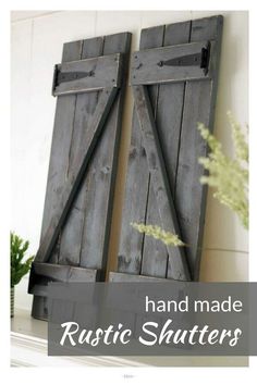 two wooden shutters with the words hand made rustic shutters on them in front of a