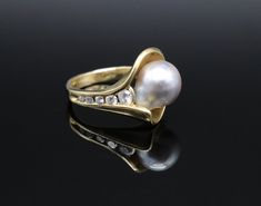 18K Yellow Gold estate ring with large semi-baroque pearl and channel set round brilliant cut diamonds on one side. Gorgeous cultured saltwater pearl that has a white silver tone with hints of iridescent pink. Approximately a size 6.5 ring. Condition as shown in images and in the retail market value appraisal report from November 2023. Appraised value is $3,425.00 Weight: 8.13g Ref#Nancy Elegant Oval Pearl Ring With Diamond Accents, Elegant Oval Pearl Ring With High Luster, Elegant Oval High Luster Pearl Ring, Elegant High Luster Oval Pearl Ring, Elegant Gold Pearl Ring With Rose Cut Diamonds, Elegant Diamond Pearl Ring, Elegant Pear-shaped Pearl Ring For Anniversary, Elegant Pear-shaped Pearl Ring For Formal Occasions, Elegant Pear Shaped Pearl Ring For Anniversary