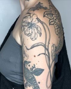 a woman with a tattoo on her arm