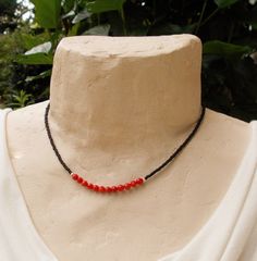 "This is a dainty beaded necklace in a combination of sparkly faceted red coral stones and tiny matte black seed beads. The stones are separated from the glass beads by small solid sterling silver faceted beads. The necklace is finished with a solid sterling silver lobster clasp. You can add an optional silver plated 2-inch extender chain for added versatility or peace of mind if this is a gift. This modern necklace gives you a great pop of color for summer. It is lightweight and the optional ex Coral Black Beads Jewellery, Black Spinel Bracelet, Red Coral Necklace, Coral Beads Necklace, Beads Design, Modern Necklace, Jewelry Set Design, Beaded Necklace Designs, Black Beaded Jewelry