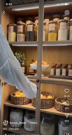 a person standing in front of shelves filled with food