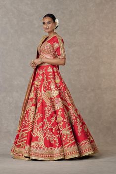 Dress in opulent elegance with this lehenga adorned with intricate motifs and embroidered hemline. Pair it with a blouse featuring similar embellishments and a brocade dupatta with embroidered detail. Complete the look with our gold foil printed tissue dupatta for added opulence. Perfect for special occasions. Brocade Dupatta, Tissue Dupatta, Lehenga And Blouse, Caribbean Fashion, Kurta Lehenga, Lehenga Pattern, Raw Silk Lehenga, Designer Outfit, Lehenga Skirt