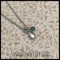 "This necklace is made with a tiny teardrop shaped stainless steel urn, a Swarovski crystal of your choice, and strung on a stainless steel chain. Flower urn has a drop of just under 3/4\" including jump rings at the top. Use the Options Pull Down menu to select your crystal and chain preferences. PLEASE NOTE: May - dk green and Dec. - turquoise has a style substitution due to Swarovski ceasing production of most of their crystals, including channel styles previously used in this listing. I no l Hypoallergenic Stainless Steel Jewelry For Memorial, Personalized Teardrop Pendant Keepsake Jewelry, Silver Teardrop Birthstone Charm Necklace, Personalized Teardrop Memorial Necklace, Silver Teardrop Birthstone Necklace, Personalized Teardrop Necklace For Memorial, Personalized Teardrop Keepsake Jewelry, Personalized Teardrop Birthstone Necklace For Anniversary, Personalized Teardrop Pendant Necklace For Keepsake