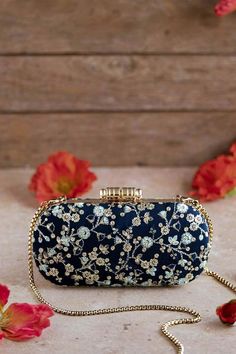 "Everything about this clutch will make you feel so luxe! The silk fabric adorned with gold floral embroidery gives this clutch a royal look. Elan clutch is a versatile, classy and a great additional to your wardrobe that will stick around with you for decades here on. Grab it! Flaunt it! Dimensions (LxB): 8\"x4\" (20.3 cm X 10.1 cm) Handle length: 47\" (120 cm) Handle drop: 23\" (58 cm) Material:   suede lining, golden metal clutch frame, golden metal sling. Features: metal lock closure, detachable metal sling." Clutch Bag Wedding, Potli Bags, Box Clutch, Royal Look, Wedding Clutch, Bridal Clutch, Diwali Gifts, Clutches, Etsy Bridesmaid Gifts