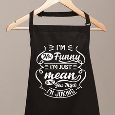 an apron hanging on a wooden hanger that says i'm not funny, i'm just mean and you think i'm joking