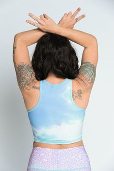 The Teeki Mermaid Tanks are cut with a high neckline and razor back crop top. They can be layered and offer gentle compression for low-impact workouts, yoga, swimming, and everyday layering. Fit: The single layer of lightweight fabric offers a gentle compression for low impact activities and daily use. Move freely in yoga class, by the pool, in the ocean, or layering without the discomfort of tight elastic bands, thick materials and underwires. If you have a small chest size the fit may not be t Stretch High Neck Crop Top For Sports, High Neck Stretch Crop Top For Sports, High Stretch Racerback Crop Top For Pilates, Racerback Stretch Crop Top For Pilates, Stretch Racerback Crop Top For Pilates, High Neck High Stretch Crop Top For Workout, High Stretch High Neck Crop Top For Workout, Blue 4-way Stretch Tops For Yoga, Blue Stretchable Tops For Yoga