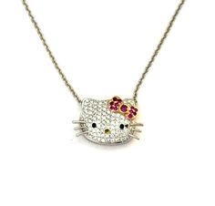 This stunning necklace features a dazzling diamond and ruby "Hello Kitty" pendant on a luxurious 18K white gold chain.  The is 1.30 carats of G-VS diamonds and .65 carats in rubies.  This is a great piece of fine jewelry to wear everyday and enjoy. Hello Kitty Necklace, Kitty Necklace, White Gold Chain, White Gold Chains, Vs Diamond, Cat Pendants, Cat Necklace, Stunning Necklace, Fashion Jewelry Necklaces