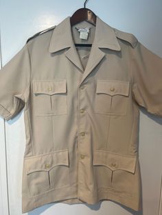 Vintage 1970s Tori Richard Honolulu Beige Medium Polyester Collar Button Down Heavy Shirt Hawaii Heavy shirt and great quality. Beautiful color & Excellent Condition, like new!  Feel free to message with any additional sizing questions! Beige Camp Shirt With Button Closure And Camp Collar, Beige Camp Shirt With Camp Collar And Button Closure, Beige Camp Shirt With Button Closure, Collared Beige Camp Shirt With Button Closure, Beige Collared Camp Shirt With Button Closure, Beige Camp Collar Shirt With Buttons, Beige Shirt With Buttons And Camp Collar, Retro Khaki Button-up Shirt, Cream Collared Shirt With Button Closure