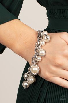 Classic white pearls and solitaire pearls that are threaded along a rod inside imperfect silver rings swing from a chunky double-linked silver chain around the wrist, creating a dramatic fringe. Features an adjustable clasp closure. Sold as one individual bracelet. Get The Complete Look! Necklace: "Revolving Refinement - White" (Sold Separately) #P9RE-WTXX-196DI Get 1st Dibs Access to new, hot items added daily here! Join bee for Live Shows on Facebook here! Enjoy Bee's video's on YouTube here! 1st Dibs, White Pearl Bracelet, White Bracelet, Rose Gold Beads, White Bracelets, Silver Frames, Paparazzi Accessories, White Necklace, White Rhinestone