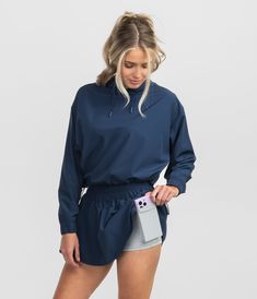 Elevate your wardrobe with the Hybrid Cropped Hoodie – where comfort, fashion, and performance seamlessly converge for any casual occasion. Maggie is 5’6" and is wearing a small Hybrid Cropped Hoodie in Classic Navy. Casual Long Sleeve Gym Hoodie, Casual Workout Hoodie With Drawstring, Fall Stretch Tops With Kangaroo Pocket, Stretch Tops With Kangaroo Pocket For Fall, Casual Long Sleeve Activewear For Spring, Half-zip Track Jacket For Fall Workout, Sporty Fall Track Jacket With Funnel Neck, Sporty Funnel Neck Track Jacket For Fall, Oversized Activewear With Drawstring Hood