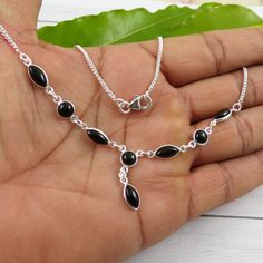 "Dainty Black Onyx Necklace, Black Stone Necklace, Bezel Necklace, Curb Chain, Black Onyx Jewelry, Boho Necklace, Chunky Necklace, M121203 Main Color: Black Size: Non Adjustable (18\" inch) Stone Size (can vary as per availability) : 6x6 Round, 5x10 Marquise      Weight: 7.5 gram  Metal - Solid 925 Sterling Silver This beautiful piece is made with Solid 925 Sterling Silver and Natural Gemstone. It is handmade and hand polished. We make multiple pieces in each style and choose gemstones with high Black Gemstone Necklace, Black Stone Necklace, Black Onyx Jewelry, Bezel Necklace, Black Onyx Necklace, Onyx Jewelry, Necklace Chunky, Onyx Necklace, Jewelry Boho