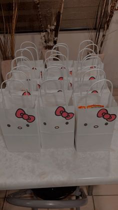 hello kitty bags are sitting on a table