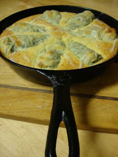 a cast iron skillet with some food in it