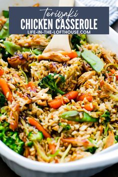 chicken casserole with broccoli and carrots in a white bowl