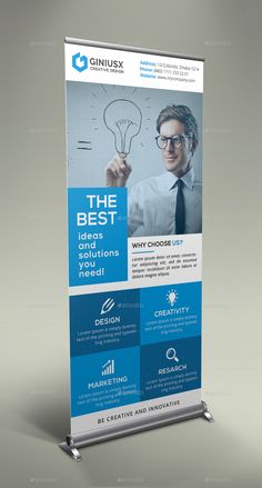 a roll up banner is shown with an image of a man holding a light bulb