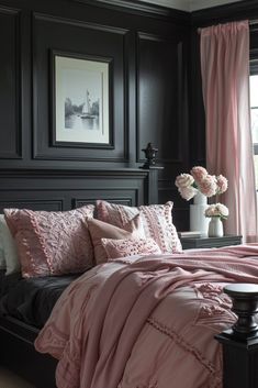 a bedroom with black walls and pink bedding