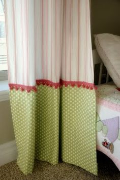 the curtains in this bedroom are pink, green and white with polka dots on them