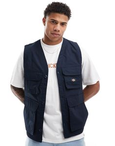 T-Shirt by Dickies Your cart called, it wants this V-neck Button placket Flap pockets Logo branding Regular fit Utility Sleeveless Tops With Pockets, Sleeveless Utility Top With Pockets, Cotton V-neck Vest With Pockets, V-neck Cotton Vest With Pockets, Utility Cotton Sleeveless Tops, Casual Workwear Vest With Patch Pockets, Navy Sleeveless Vest With Pockets, Casual Sleeveless Vest With Patch Pockets, Navy Casual Tops With Pockets