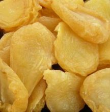 peeled yellow fruit sitting on top of a table