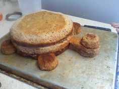 there is a very large sandwich on top of the pans that are ready to be cooked