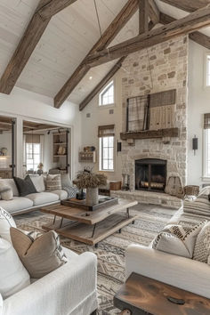 a living room filled with lots of furniture and a fire place in the middle of it