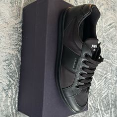 New Men’s Prada Sneakers Black Calf Leather Sneakers With Rubber Heel Cap, Designer Low-top Sneakers For Business, Masculine Black Low-top Sneakers, Designer Black Sneakers With Stitched Sole, Designer Black Sneakers With Rubber Heel Cap, Designer Black Leather Sneakers, Prada Sneakers, Man Style, Prada Shoes