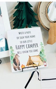 a sign that says write a note or sign your name so our little happy camper will know you came