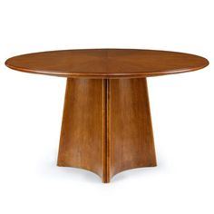 an oval wooden table with two curved legs