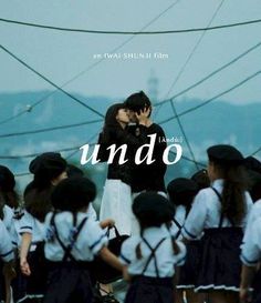 two people kissing each other in front of a group of school children with the caption undo