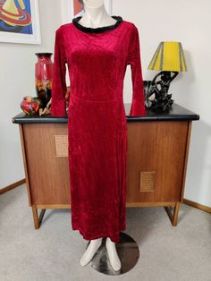 This could be your Christmas dress if the weather isn't hot and sunny, as it often happens  The dress is by Kathie Lee ee in a US 12 to 14. The dress is a crushed velvet in a gorgeous ruby red  colour. The neckline is scooped with a black faux fur edging collar. The dress is waisted and the skirt is straight to below calf length. The fabric has some stretch and I'd in good condition. Measurements are Shoulder to shoulder 40cm Bust 98cm Waist 86cm Hips 104cm Length shoulder to hem 132cm Fitted V-neck Velvet Holiday Dress, Red Crushed Velvet Dress, Red Velvet V-neck Evening Dress, Fitted Velvet V-neck Midi Dress, Black Faux Fur, Red Colour, Dress Midi, Crushed Velvet, Midi Length Dress