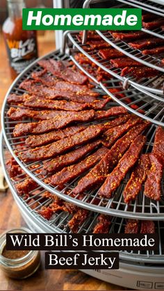 a close up of food on a grill with the words wild bill's homemade beef jerry