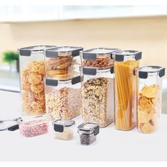 an assortment of food in glass containers on a table