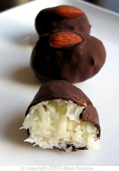 two pieces of chocolate covered dessert on a white plate