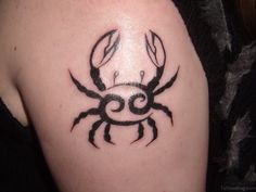 a black and white photo of a scorpion tattoo