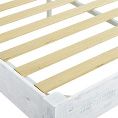 a bed frame with wooden slats on it