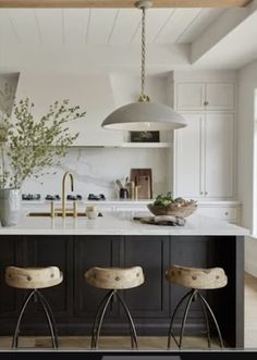 two stools are in front of the kitchen island