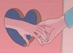 two hands touching each other over a heart shaped object on a pink and blue background