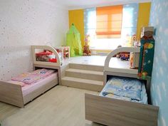 a bedroom with bunk beds and stairs in it