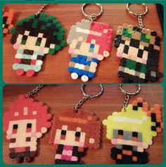 four different key chains that are made out of legos and plastic beads, each with an image of the same character on them