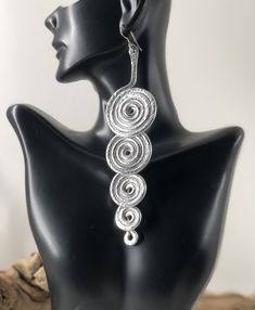 Silver Hammered Spiral Earrings made from aluminum.  Note:  All of my pieces are handmade and made to order for my customers.  Each piece will be uniquely designed just for you and therefore may vary (slightly) from what is pictured. Silver Spiral Earrings For Party, Handmade Spiral Silver Jewelry, Spiral Metal Earrings For Party, Spiral Wire Wrapped Earrings For Party, Wire Wrapped Spiral Earrings For Parties, Party Spiral Wire Wrapped Earrings, Nickel Free Artistic Jewelry For Parties, Nickel-free Artistic Jewelry For Parties, Artistic Nickel-free Jewelry For Parties