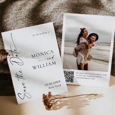 two wedding cards sitting on top of a bed next to each other, with the couple's name printed on them