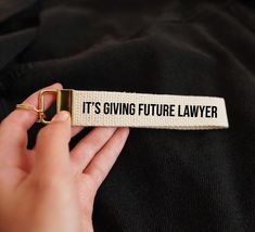 It's giving Future Lawyer Key Fob - Law Student Gift - Heat pressed vinyl - Material : Cotton webbing - Approx. length Including hardware: 1 x 6 inch - Production time: 1-3 business days - Made with lots of LOVE in Montreal,QC :) **Please note that the length of the keychain & colors may vary slightly from photos. Thank you for visiting LoveySlimey Shop, if you have any questions or request please contact us ❤ Gifts For Law Students, Lawyer Gifts, Law Student, Heat Press Vinyl, Law School, Lawyer, Student Gifts, Key Fob, Wedding Shop