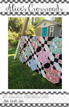 an image of a quilt on the grass in front of a shed with text overlay that reads, alice's crossroads