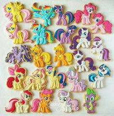 a bunch of little pony cookies sitting on top of a table