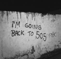 graffiti written on the side of a wall that says i'm going back to 50 cents